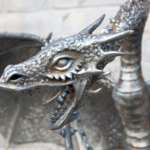 Кованая скульптура "Дракон с булавой" из металла